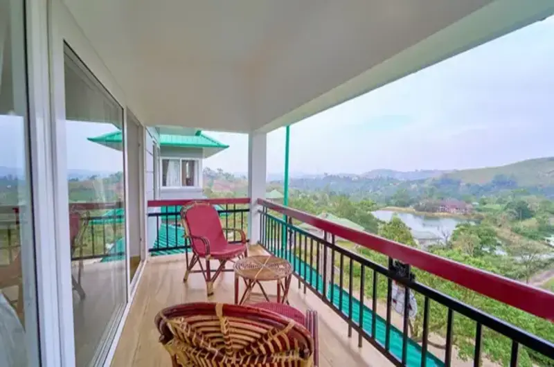 Private balcony seating with hill views at Priyas Villa Vagamon