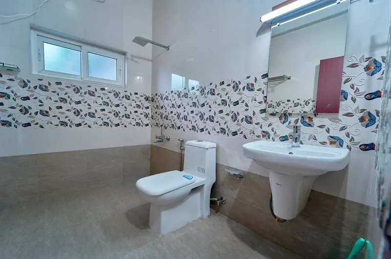 Clean and modern attached bathroom facilities at Priyas Villa Vagamon