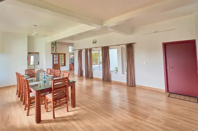 Well-lit dining area and table at Priyas Villa Vagamon