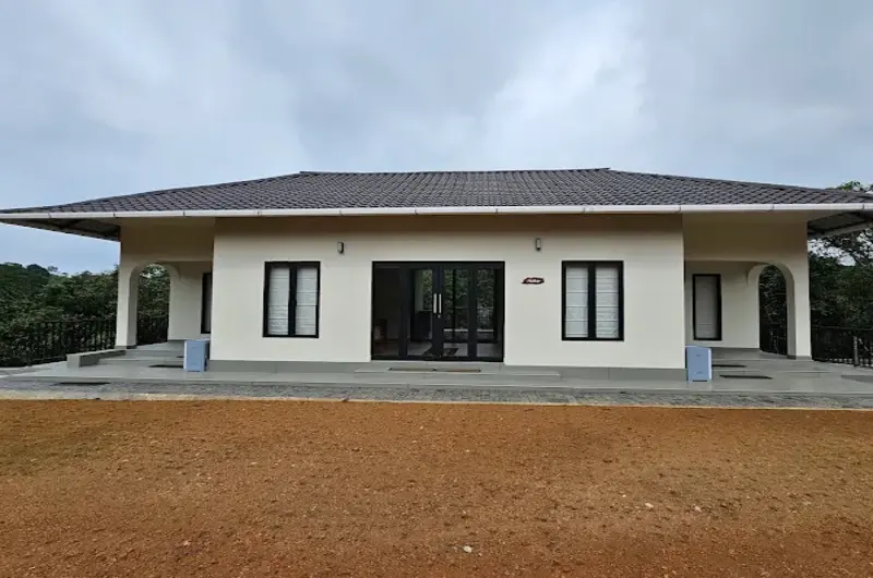 Modern single-story cottage architecture at 8.5 Acres Vagamon