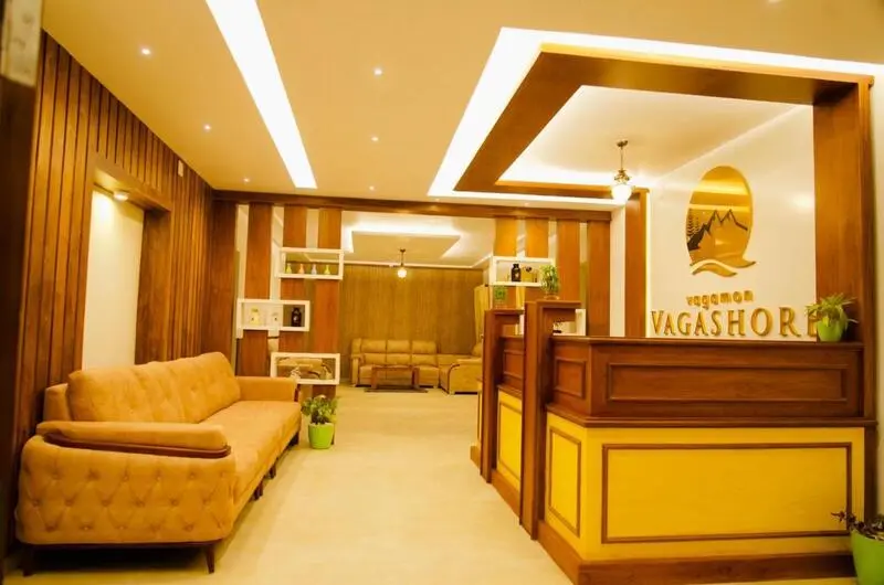 Modern lobby and waiting lounge with wooden decor at Vagamon Vagashore