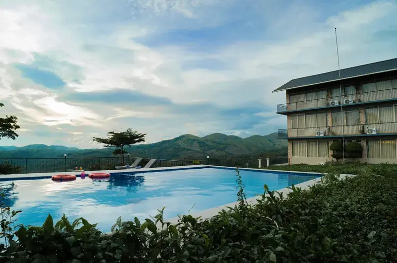 Outdoor swimming pool area at Ice Hills Resort with scenic mountain views