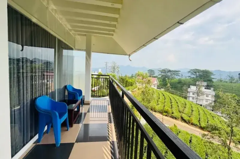 Pine Clough Resort room balcony with hillside view | Scenic balcony perspective in Vagamon resort