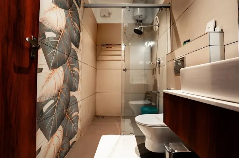 Clean en-suite bathroom with modern fixtures at Golden Meadows Resort Vagamon