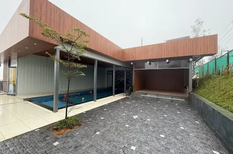 Outdoor courtyard and poolside deck area at Golden Meadows Resort Vagamon