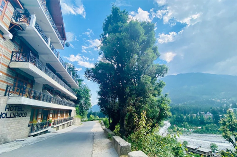Multi-story hotel building with balcony views at Vaga Nakshathra Suites Vagamon