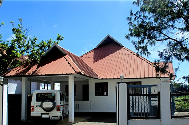 Tiled red roof cottage building at Vaga Nakshathra Suites Vagamon