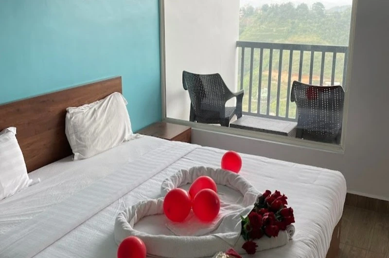 Cozy bedroom suite with private balcony view at Vagamon Hill Chimes Vagamon