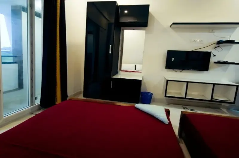 Deluxe room with private balcony access at Rock Lake Villa Vagamon