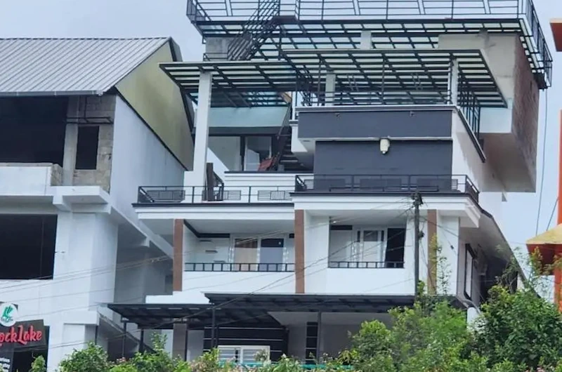 Exterior view of Rock Lake Villa building nestled in Vagamon hills