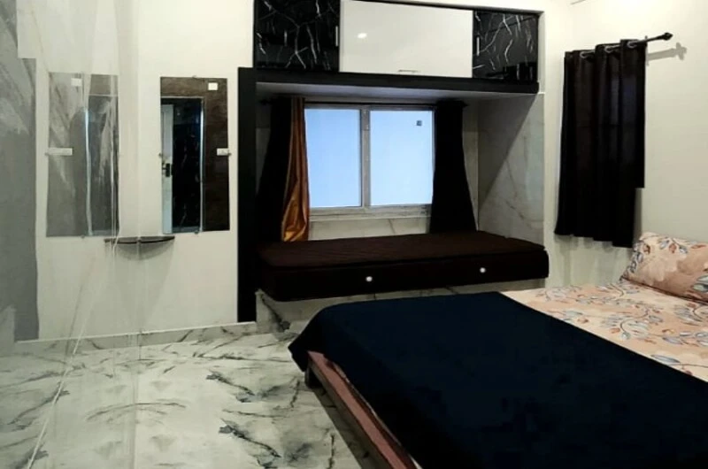 Modern guest bedroom featuring stylish dark accent wall at Rock Lake Villa Vagamon