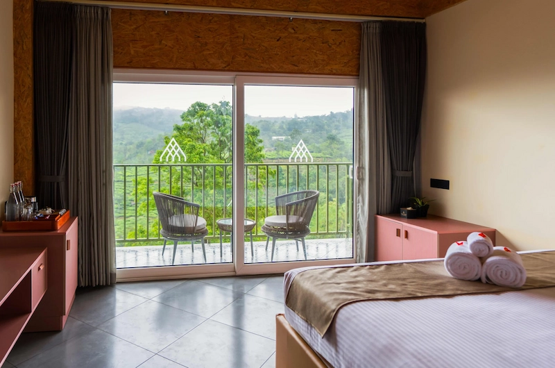 Luxury guest room with glass balcony view at Santuario Resort Vagamon