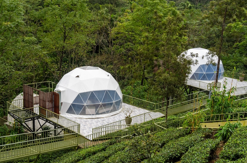 Luxury dome cottage overlooking tea plantation hills and natural green landscapes in Vagamon