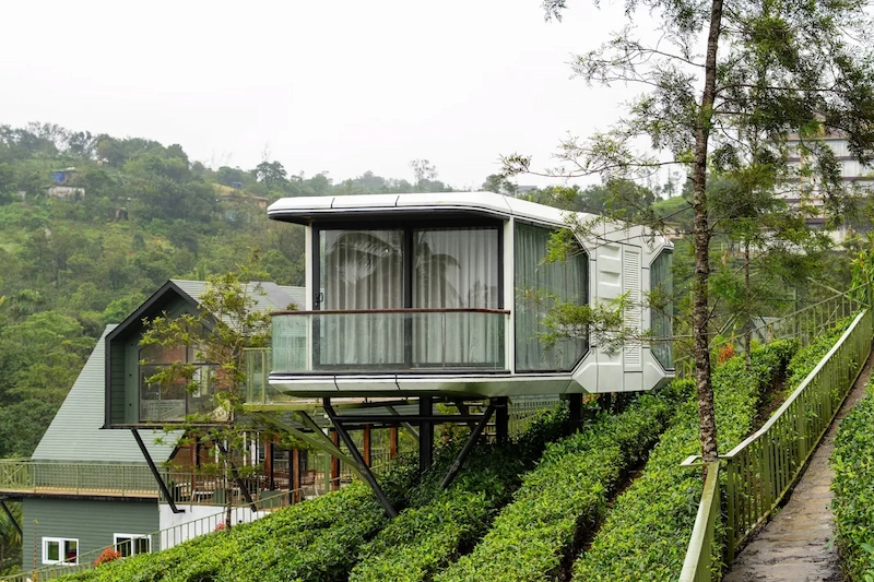 Modern elevated cottage stay with private balcony surrounded by tea gardens in Vagamon