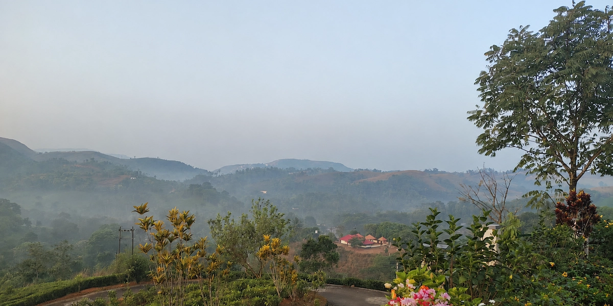 Misty green rolling hills and mountain views in Vagamon Kerala during Onam season